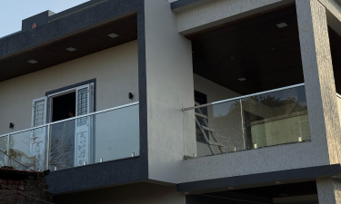 Stainless steel and glass railing by Amol Enterprises